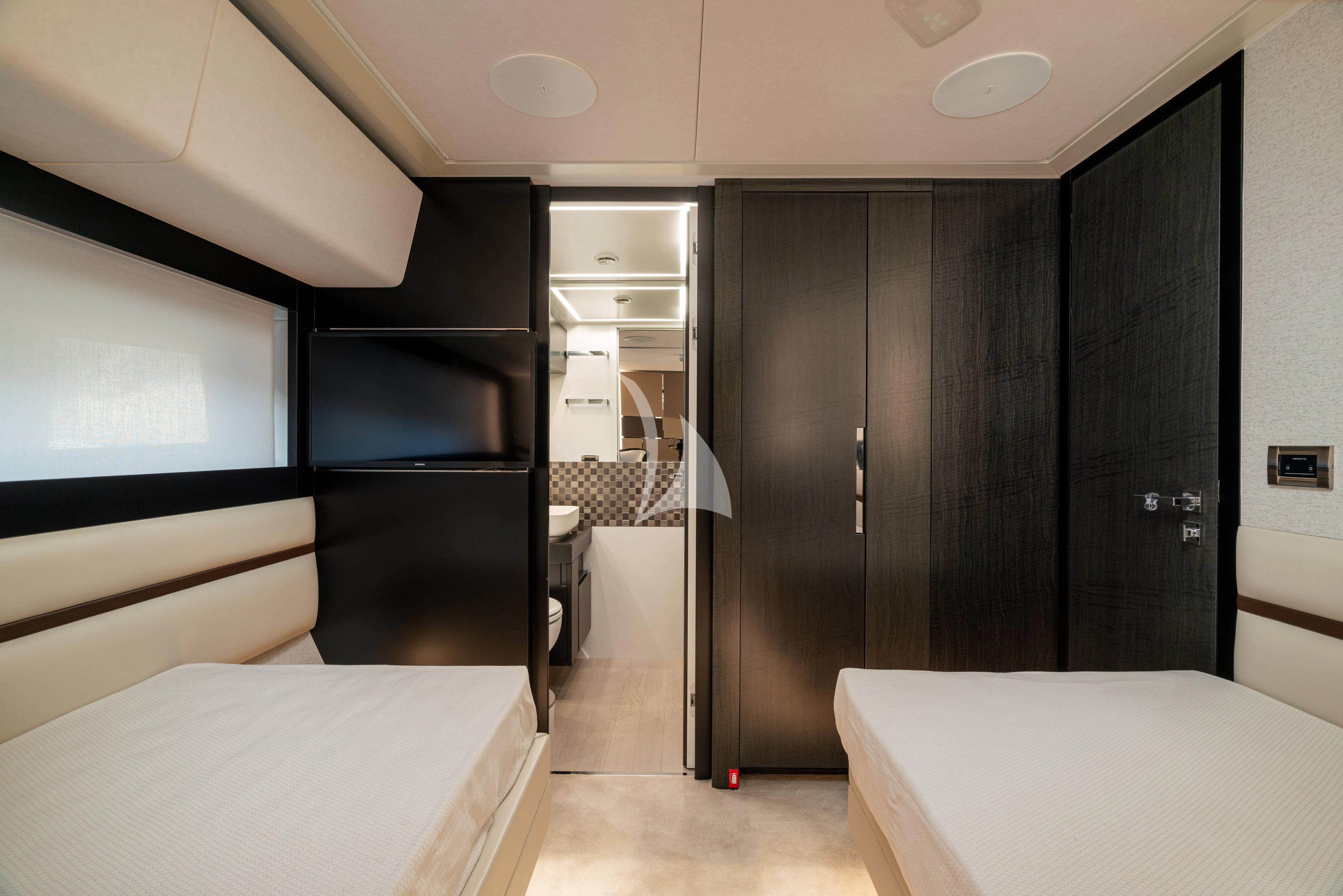 a room with a bed and a closet aboard SOPHIA Yacht for Sale