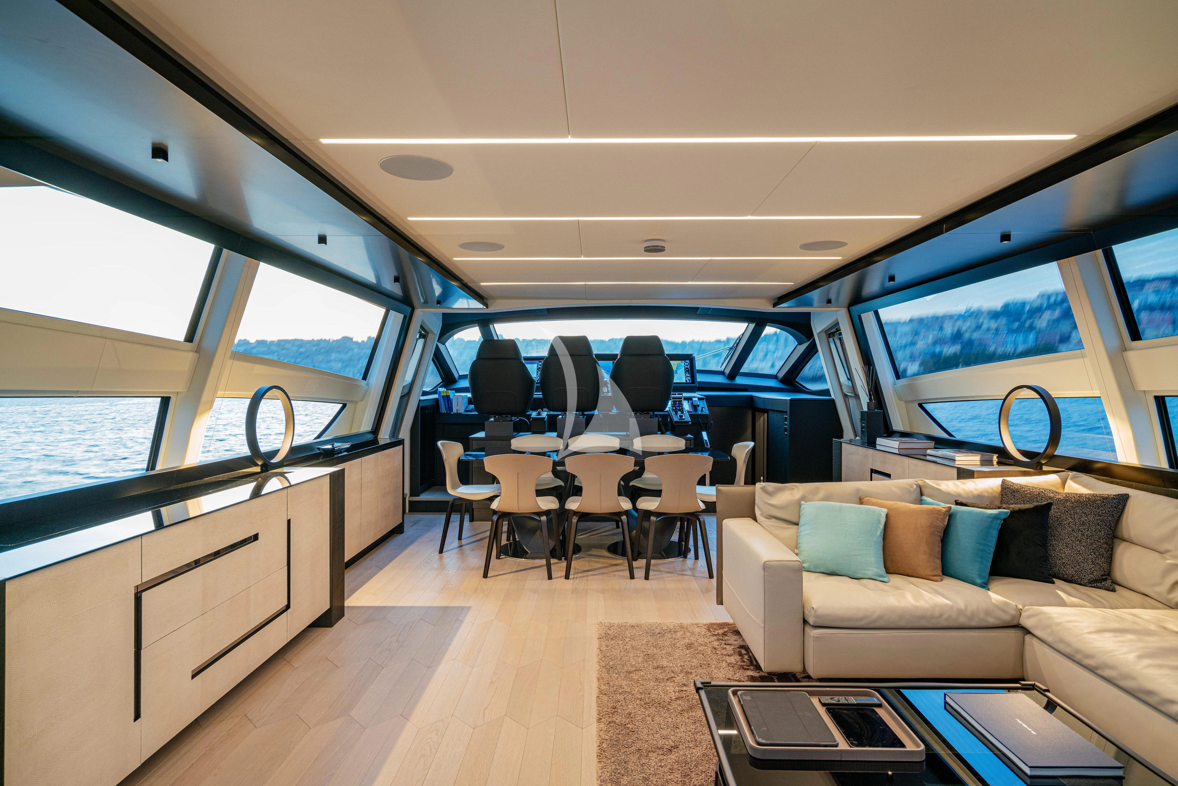 inside of a vehicle with a couch and chairs and tables aboard SOPHIA Yacht for Sale