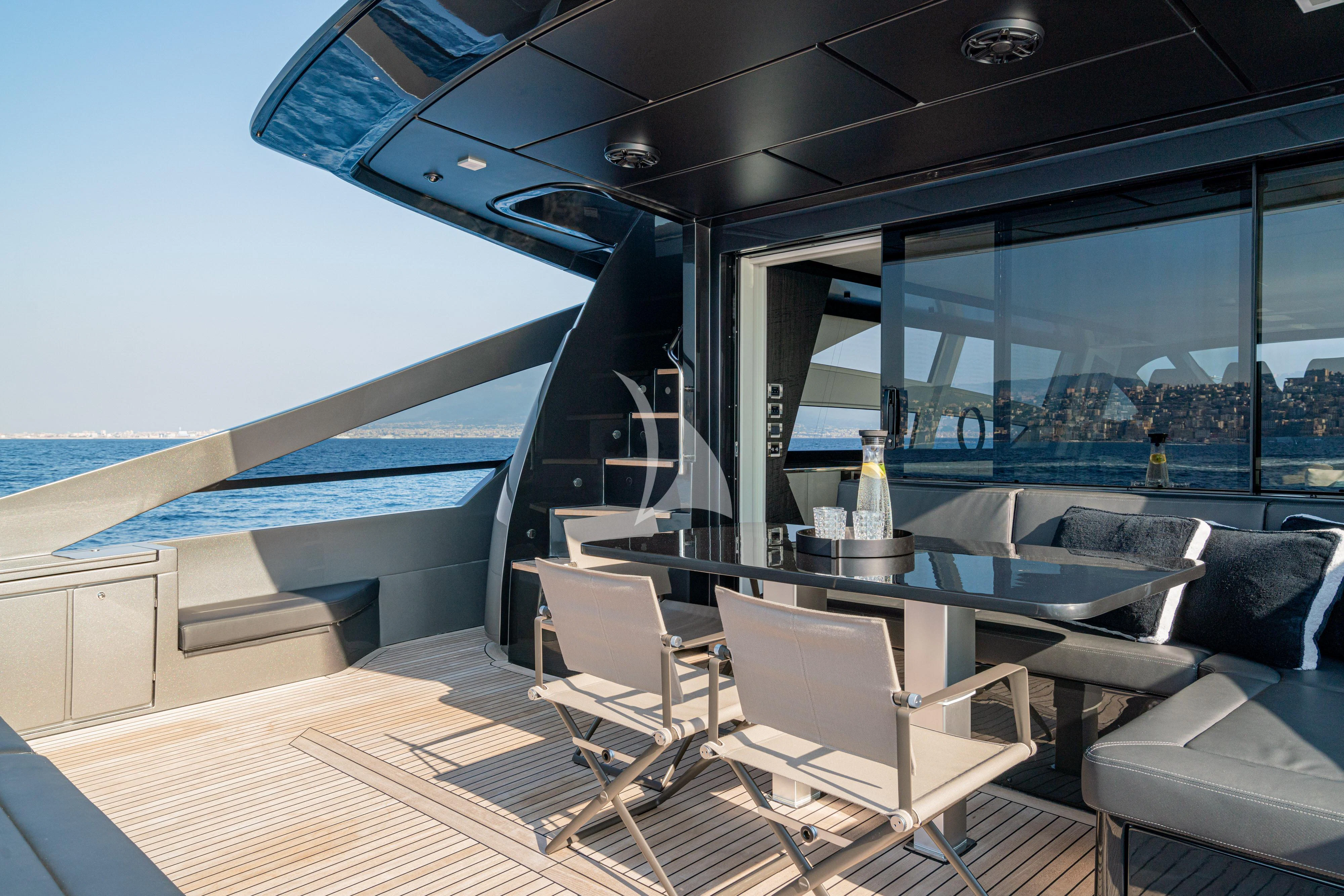 a room with a table and chairs aboard SOPHIA Yacht for Sale