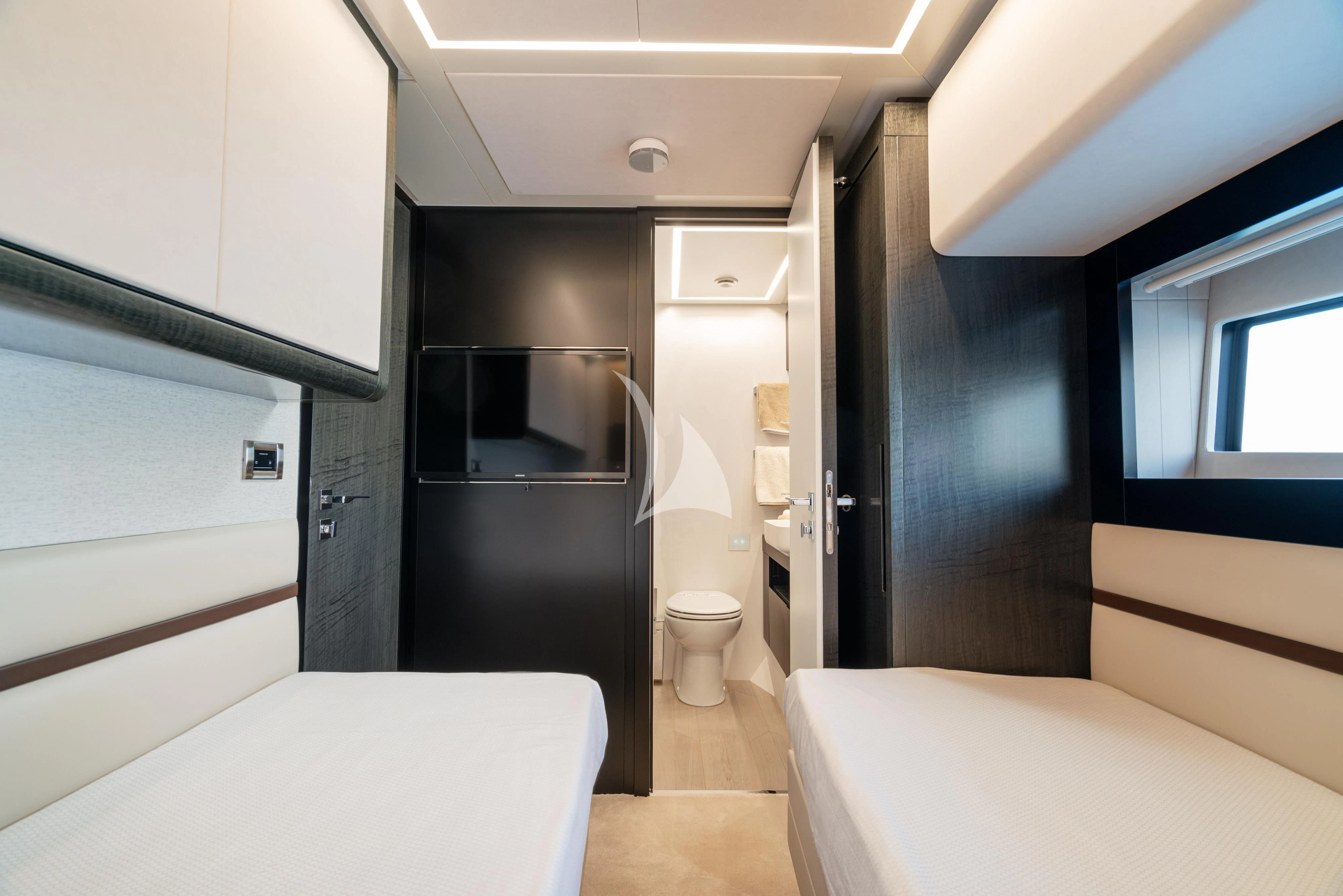 a bathroom with a toilet and a bathtub aboard SOPHIA Yacht for Sale