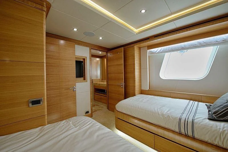 a cabin with two beds aboard UAQ 1 Yacht for Sale