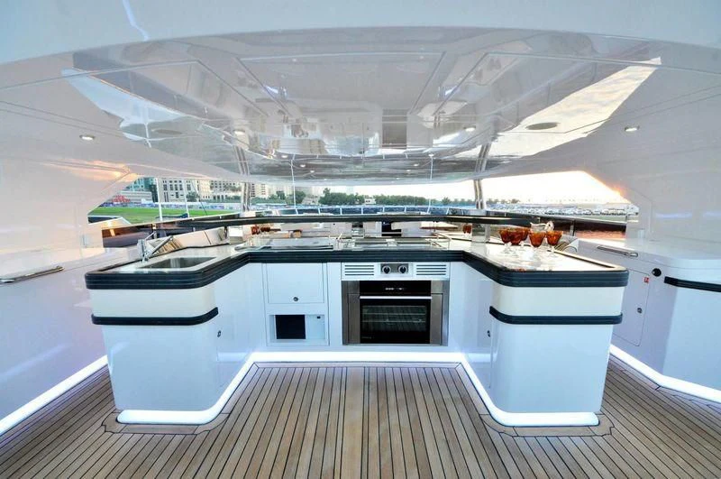 a kitchen with a large white stove aboard UAQ 1 Yacht for Sale