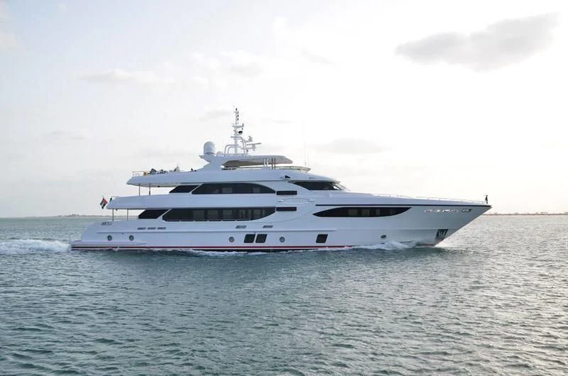 a large white boat in the water aboard UAQ 1 Yacht for Sale