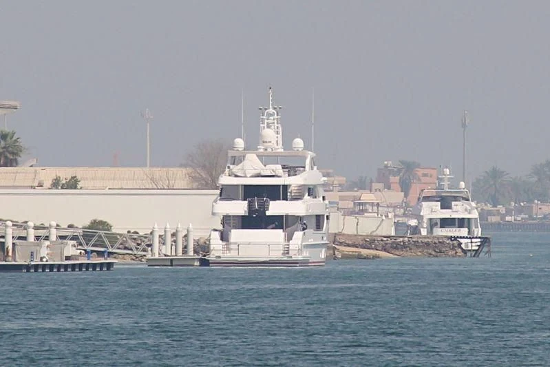 a large white ship in the water aboard UAQ 1 Yacht for Sale