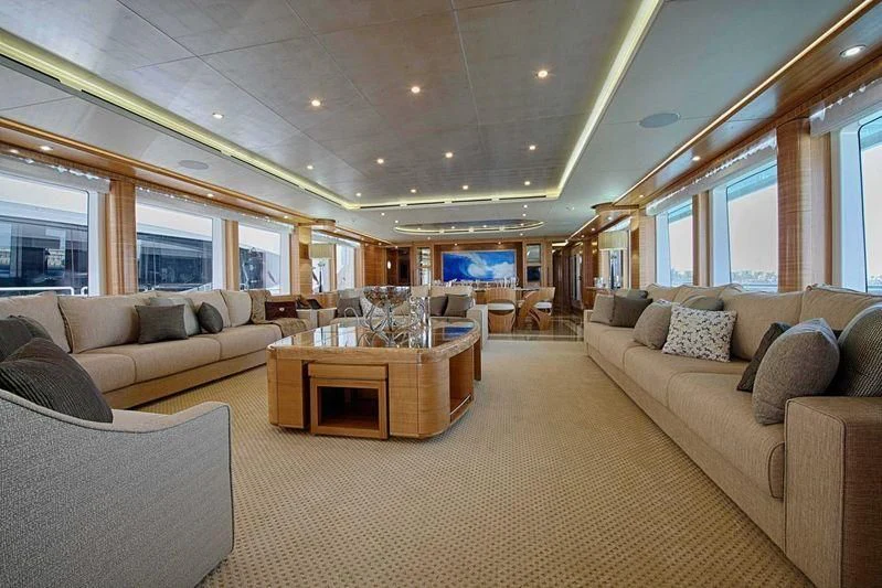 a living room with a couch and a table aboard UAQ 1 Yacht for Sale
