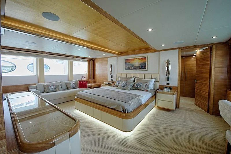 a large bedroom with a bed aboard UAQ 1 Yacht for Sale