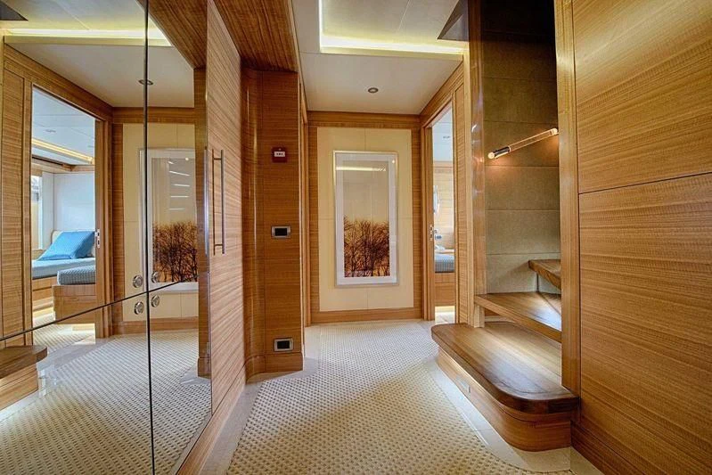 a room with a large glass door aboard UAQ 1 Yacht for Sale