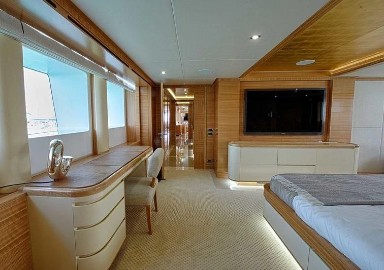 a room with a bed and a tv aboard UAQ 1 Yacht for Sale