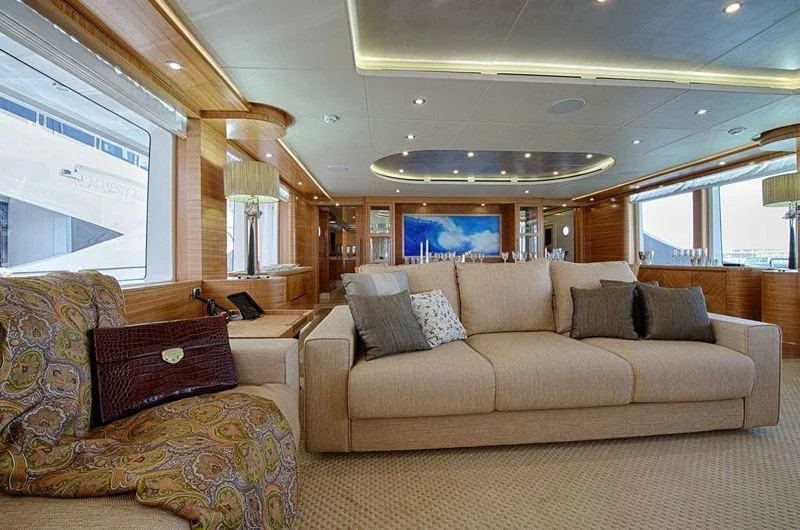 a living room with a couch and a tv aboard UAQ 1 Yacht for Sale