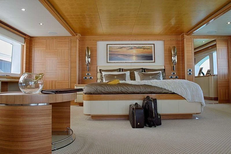 a bedroom with a bed and luggage aboard UAQ 1 Yacht for Sale