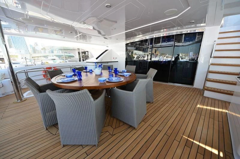 a room with a table and chairs aboard UAQ 1 Yacht for Sale