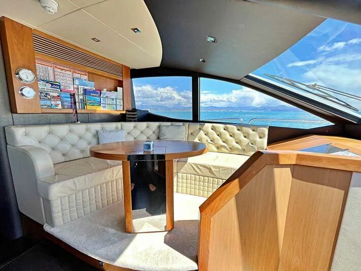 a room with a table and chairs aboard RAY 3 Yacht for Sale