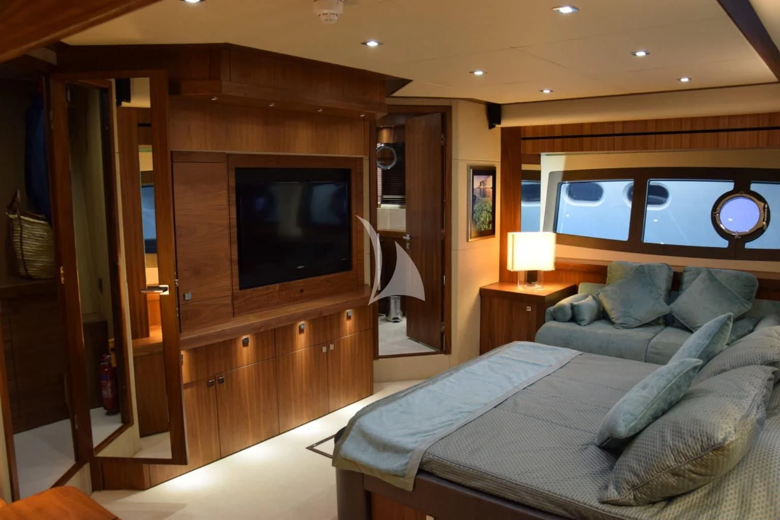 a bedroom with a bed and a television aboard RAY 3 Yacht for Sale
