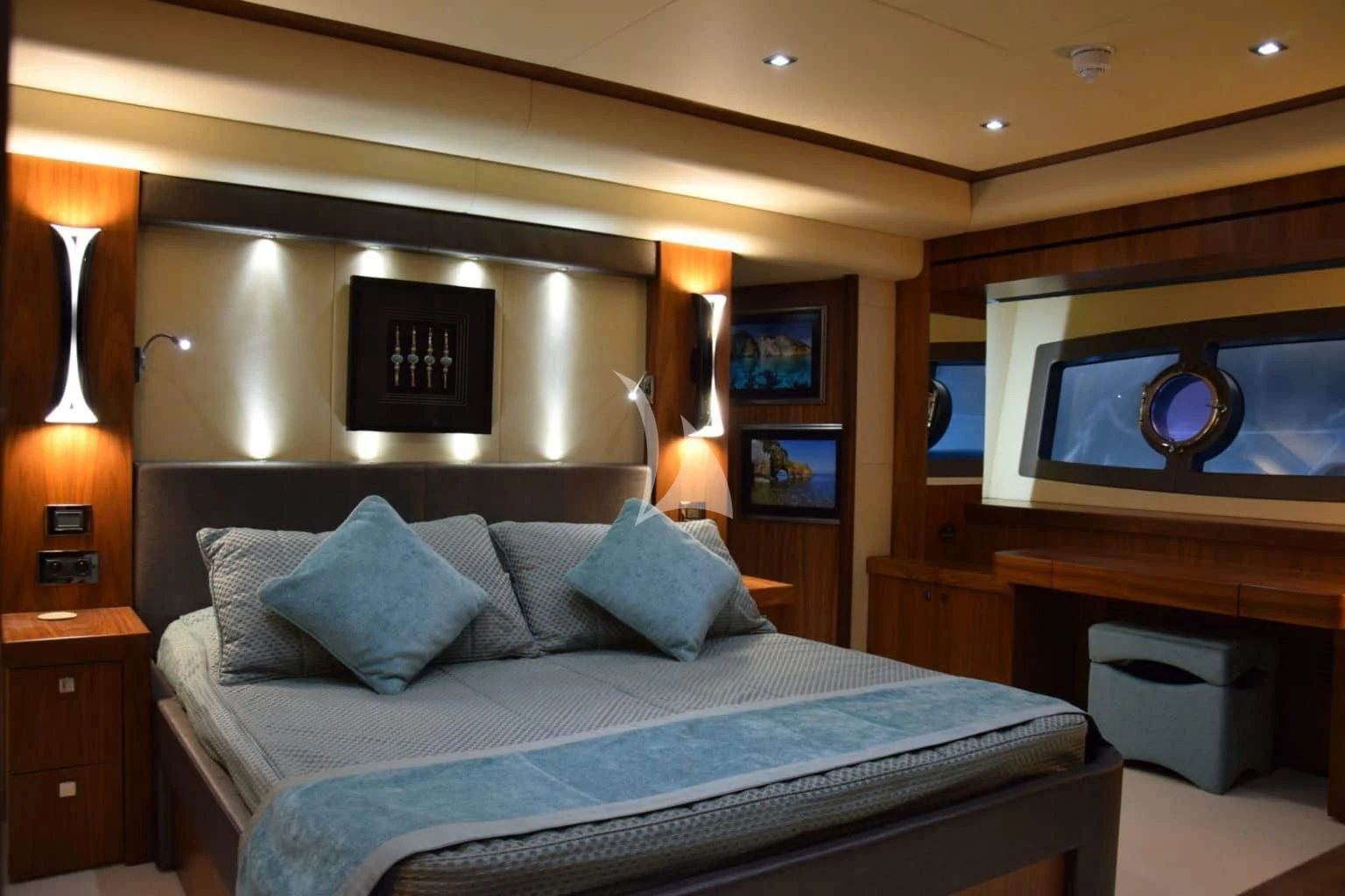 a bed with a blue comforter aboard RAY 3 Yacht for Sale