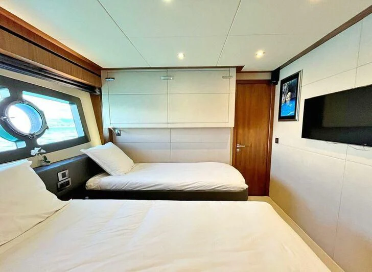 a room with a bed and a tv aboard RAY 3 Yacht for Sale