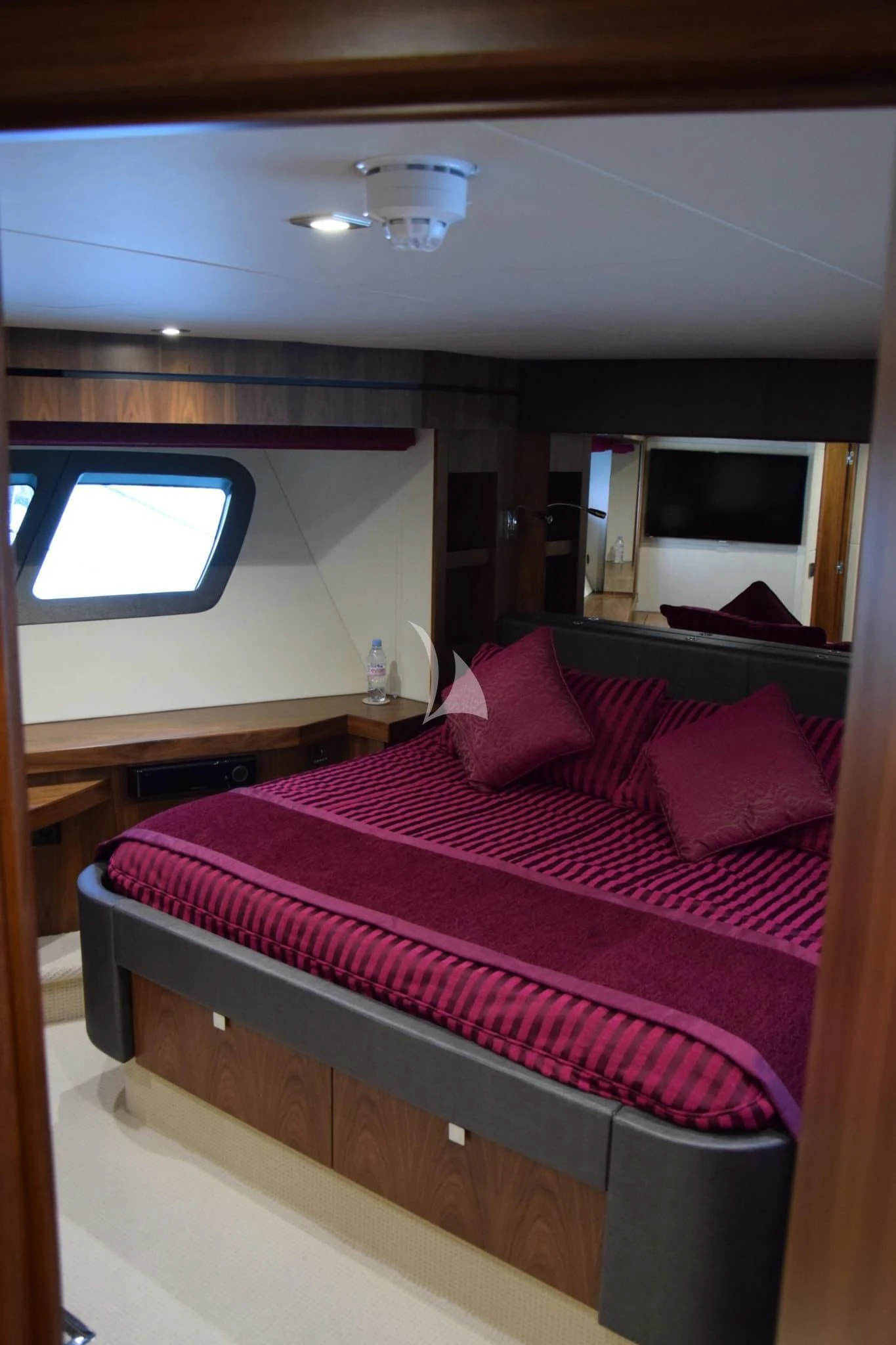 a room with a bed and a window aboard RAY 3 Yacht for Sale