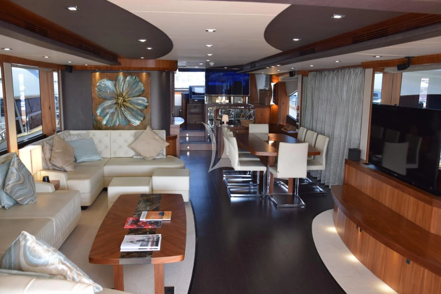 a living room with a couch and a table aboard RAY 3 Yacht for Sale