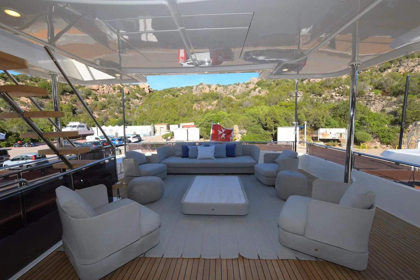 a room with a table and chairs aboard BLESSED ONE Yacht for Sale
