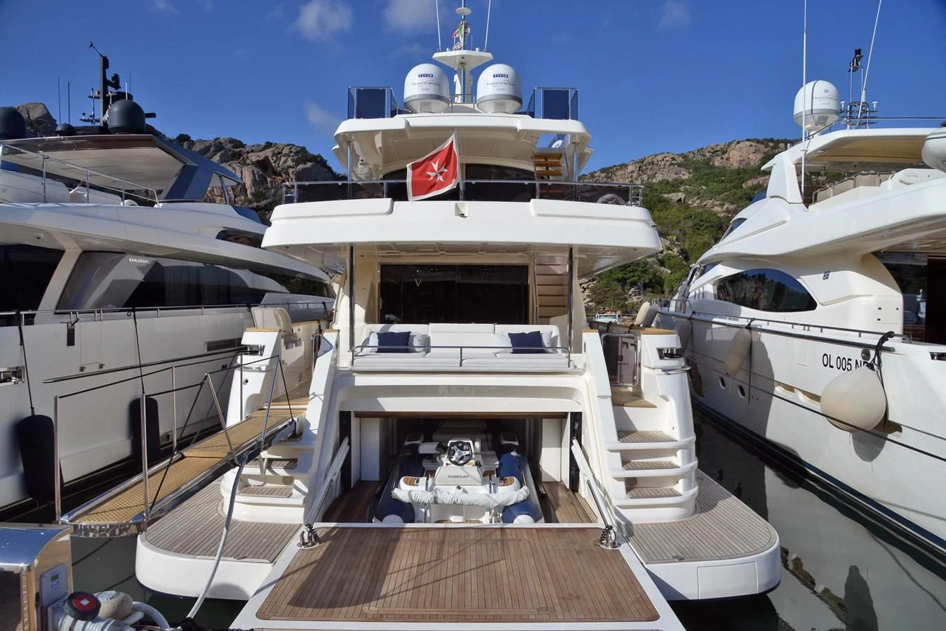 a group of boats are parked in a harbor aboard BLESSED ONE Yacht for Sale