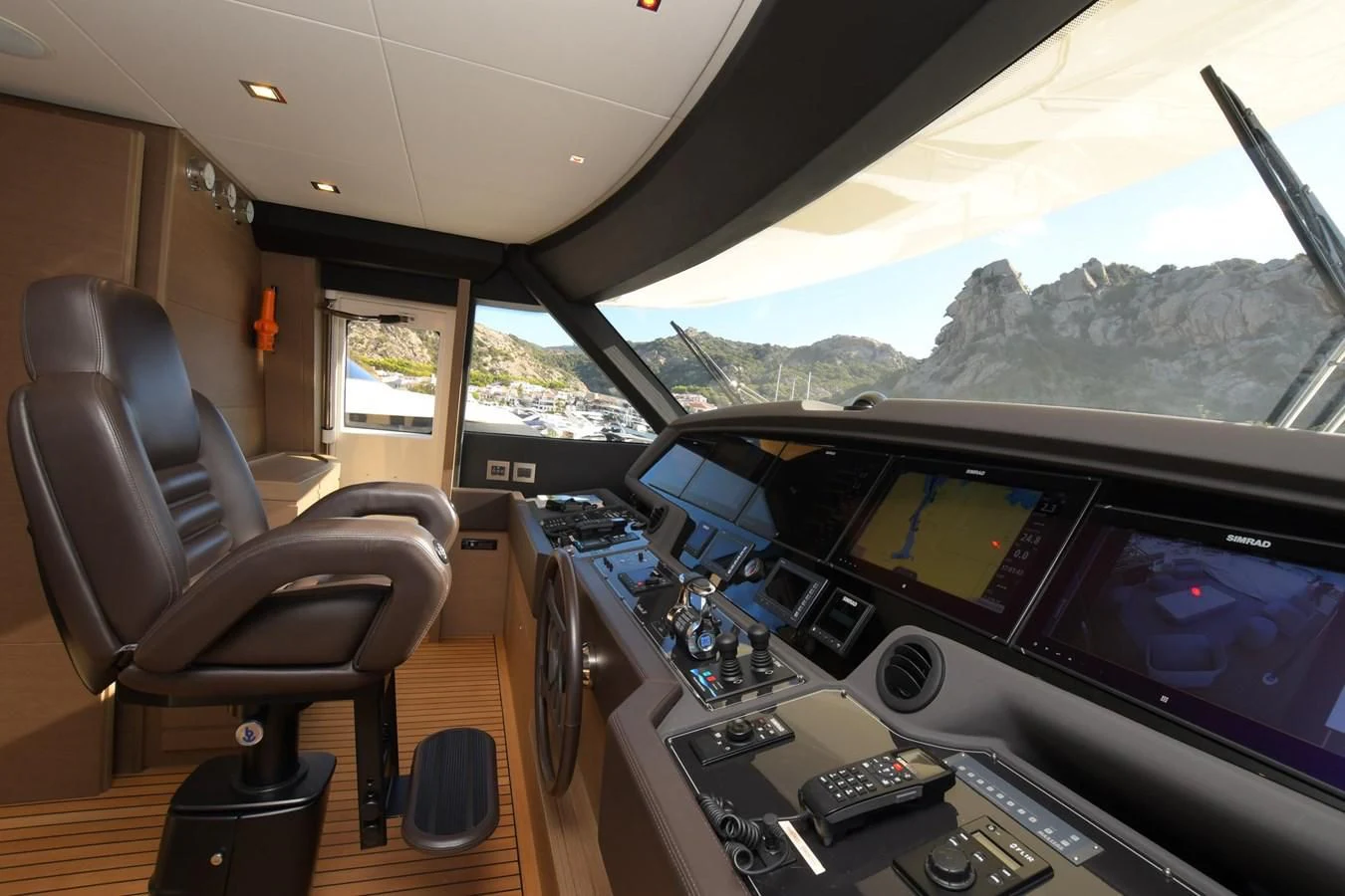 inside of a car with a view of mountains and trees aboard BLESSED ONE Yacht for Sale