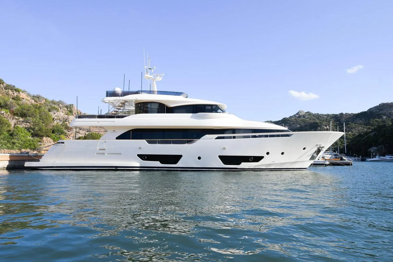 a white yacht in the water aboard BLESSED ONE Yacht for Sale