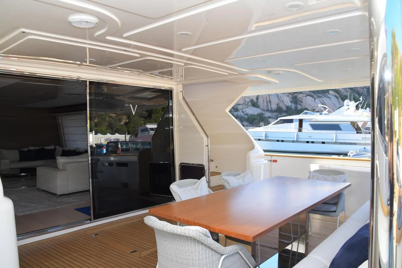 a room with a table and chairs aboard BLESSED ONE Yacht for Sale