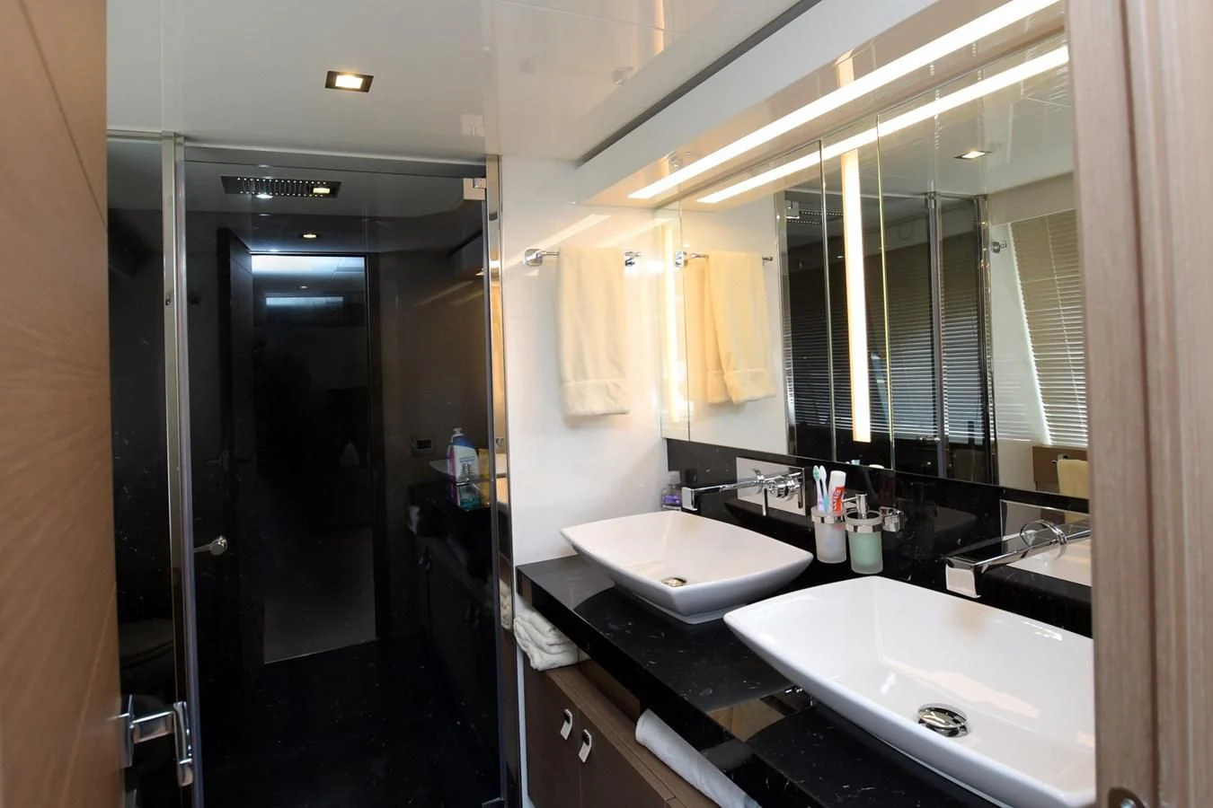 a bathroom with a sink and a mirror aboard BLESSED ONE Yacht for Sale