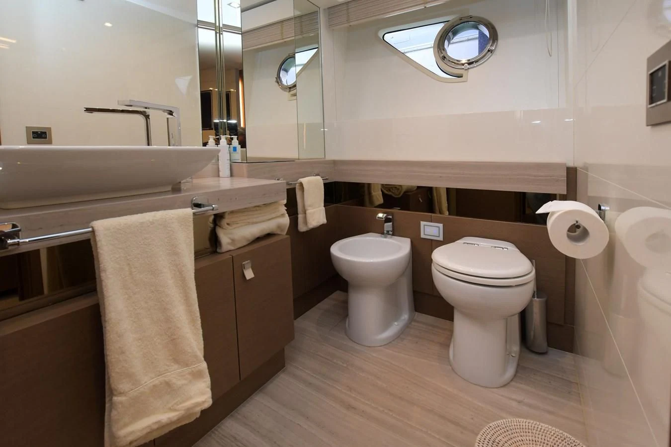 a bathroom with a toilet and a sink aboard BLESSED ONE Yacht for Sale