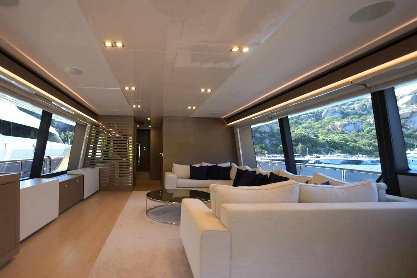 a room with a couch and a window aboard BLESSED ONE Yacht for Sale