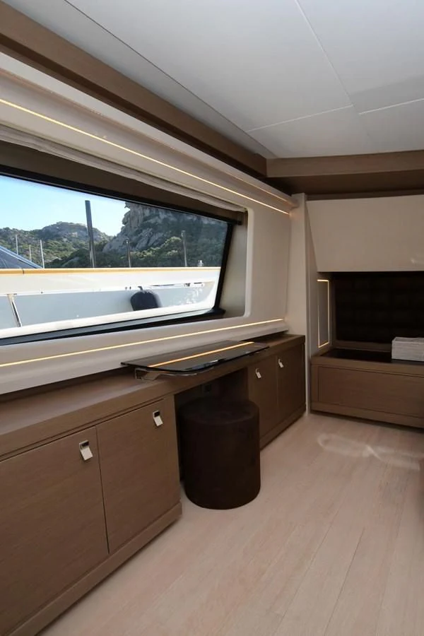 a room with a window and a desk aboard BLESSED ONE Yacht for Sale
