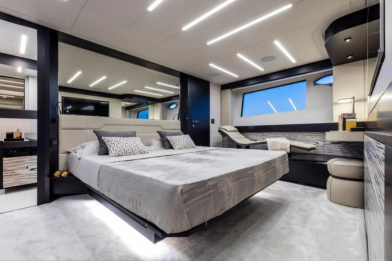 a large bedroom with a large bed aboard PERSHING 8X Yacht for Sale
