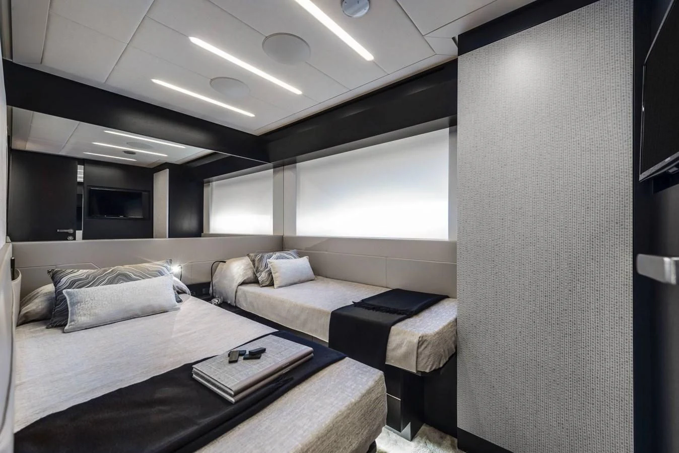 a room with two beds aboard PERSHING 8X Yacht for Sale