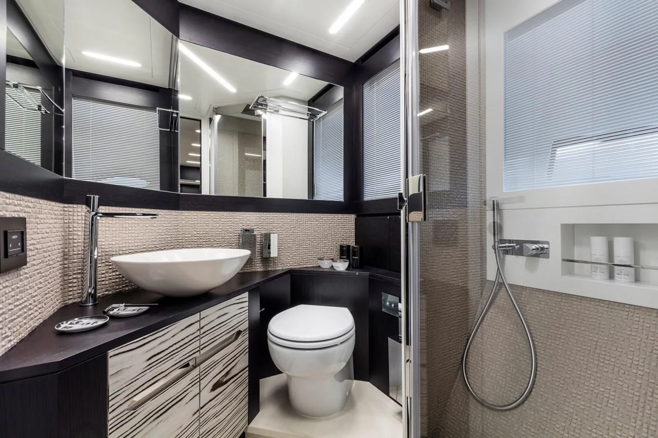 a bathroom with a sink and a toilet aboard PERSHING 8X Yacht for Sale