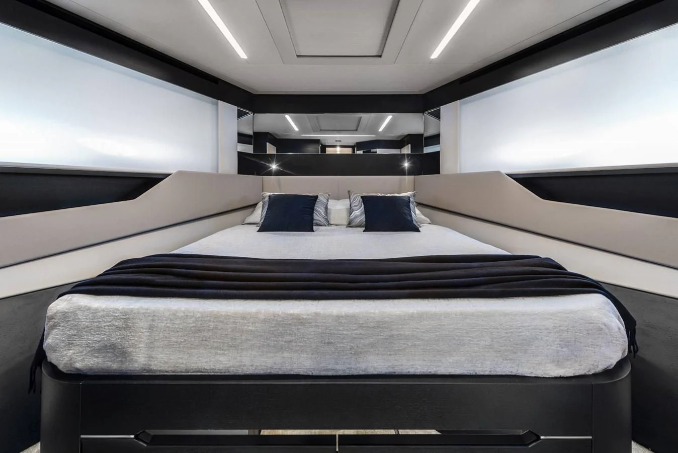 a room with a bed and a window aboard PERSHING 8X Yacht for Sale