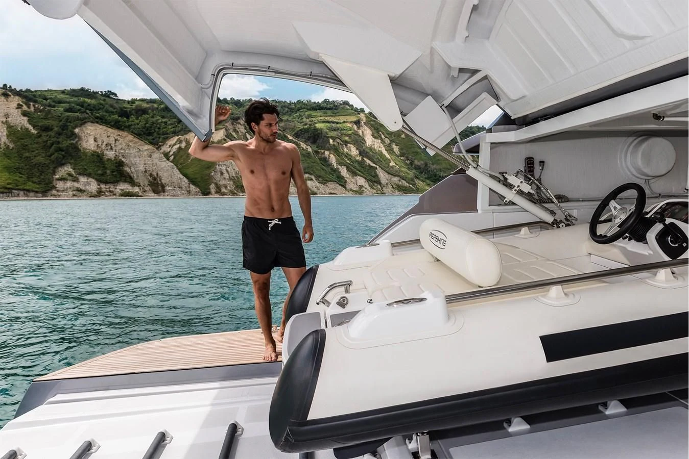 a man standing on a boat aboard PERSHING 8X Yacht for Sale