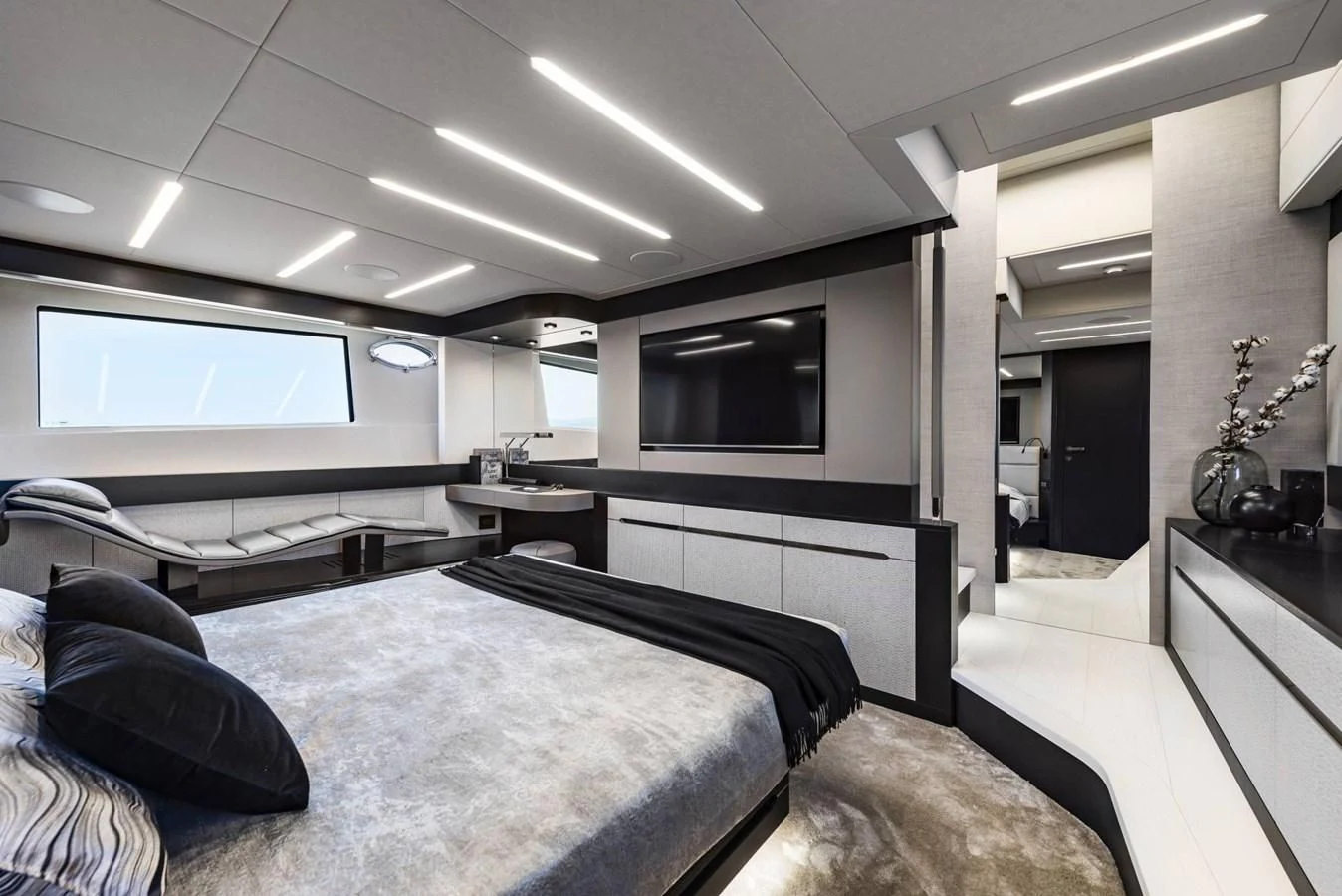 a room with a bed and a tv aboard PERSHING 8X Yacht for Sale
