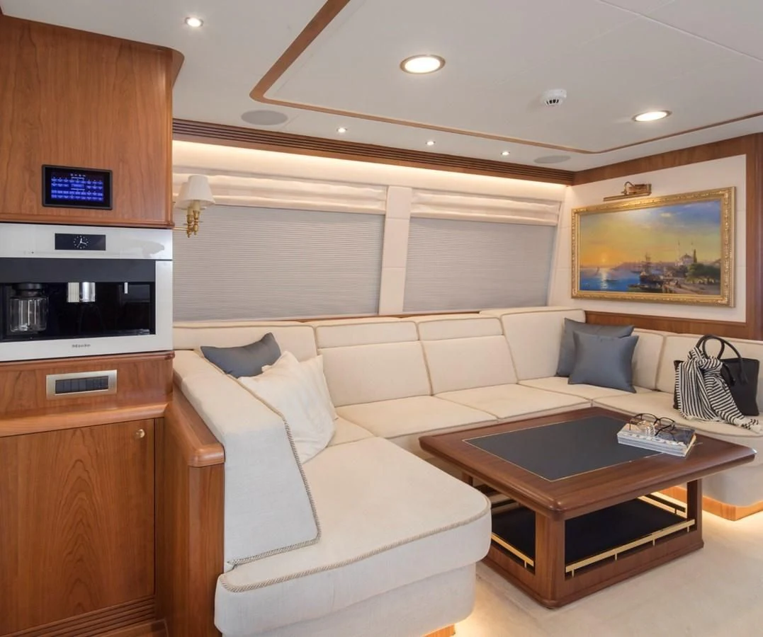 a living room with a couch and a coffee table aboard VALENCIA Yacht for Sale