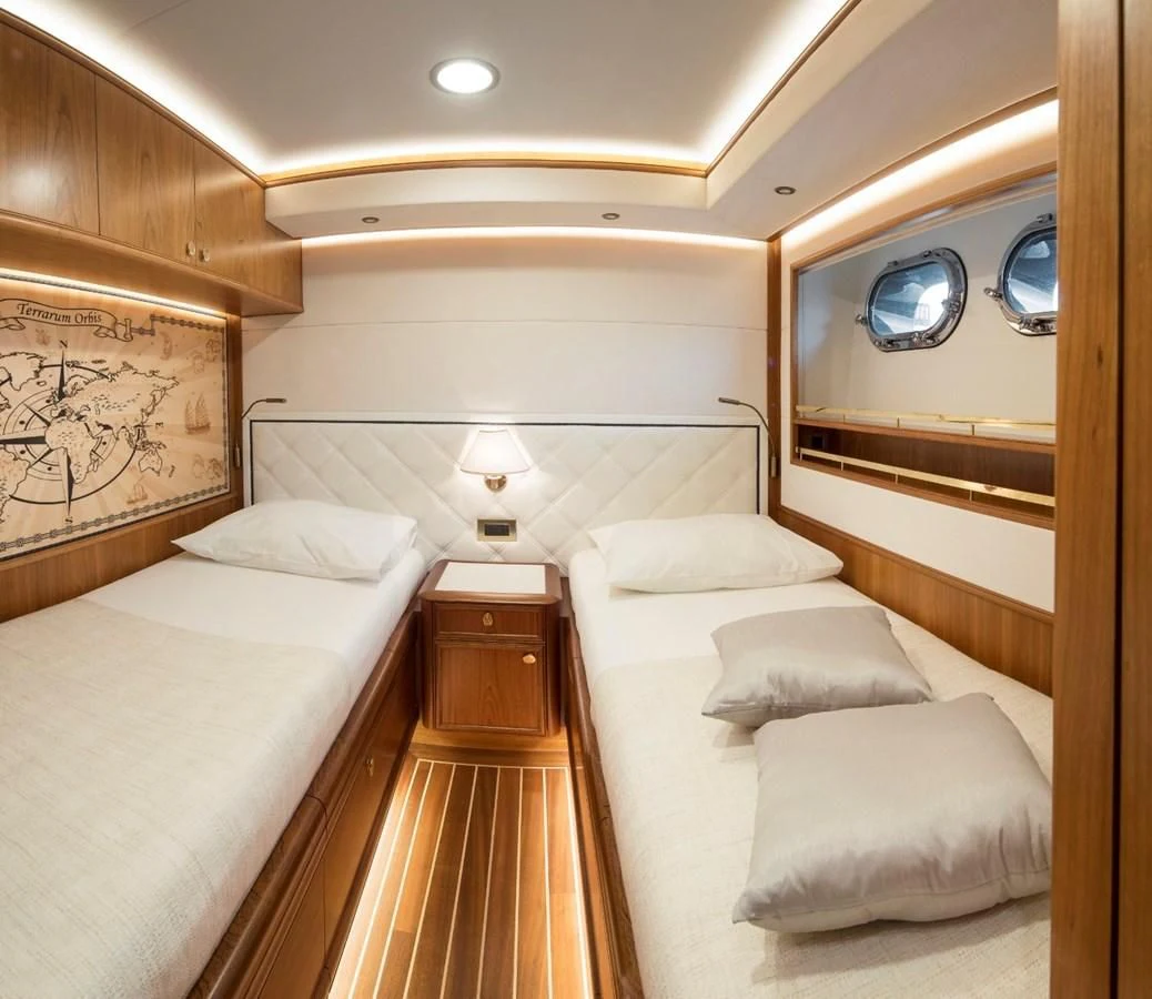 a room with two beds aboard VALENCIA Yacht for Sale