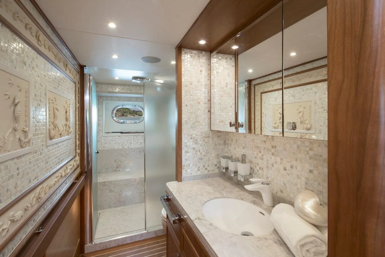 a bathroom with a large mirror aboard VALENCIA Yacht for Sale