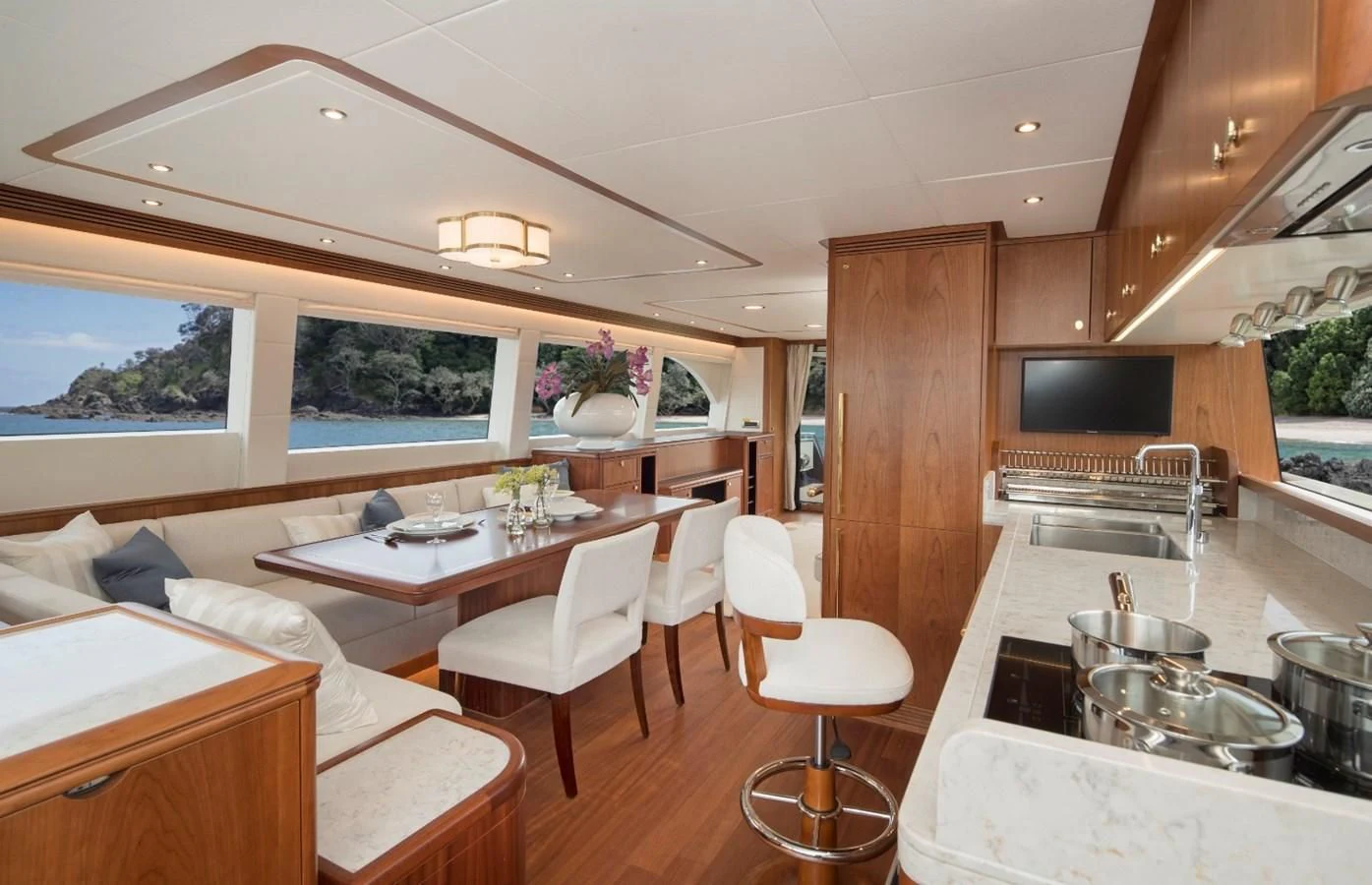 a kitchen with a dining table aboard VALENCIA Yacht for Sale