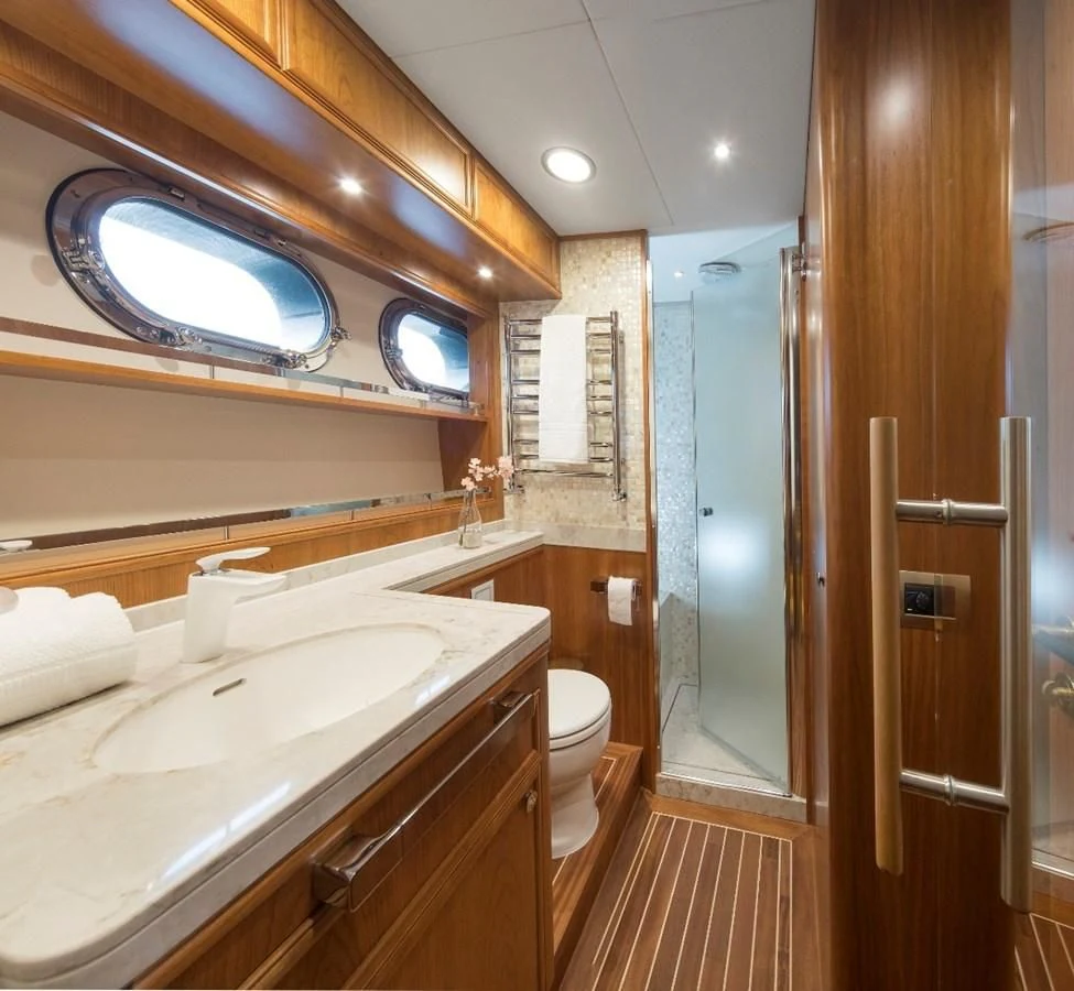 a bathroom with a large mirror aboard VALENCIA Yacht for Sale