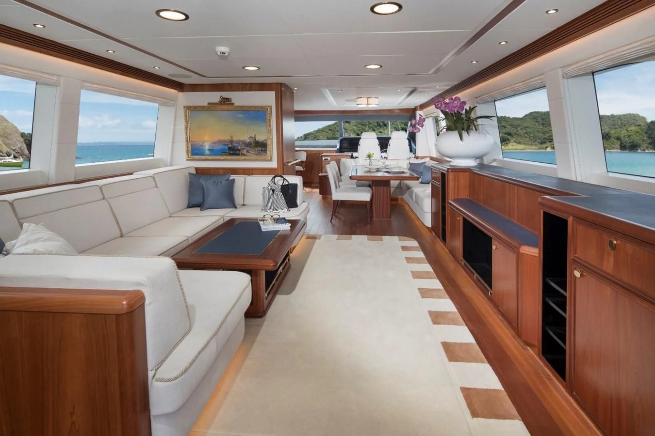 a room with a couch and a table and a window aboard VALENCIA Yacht for Sale