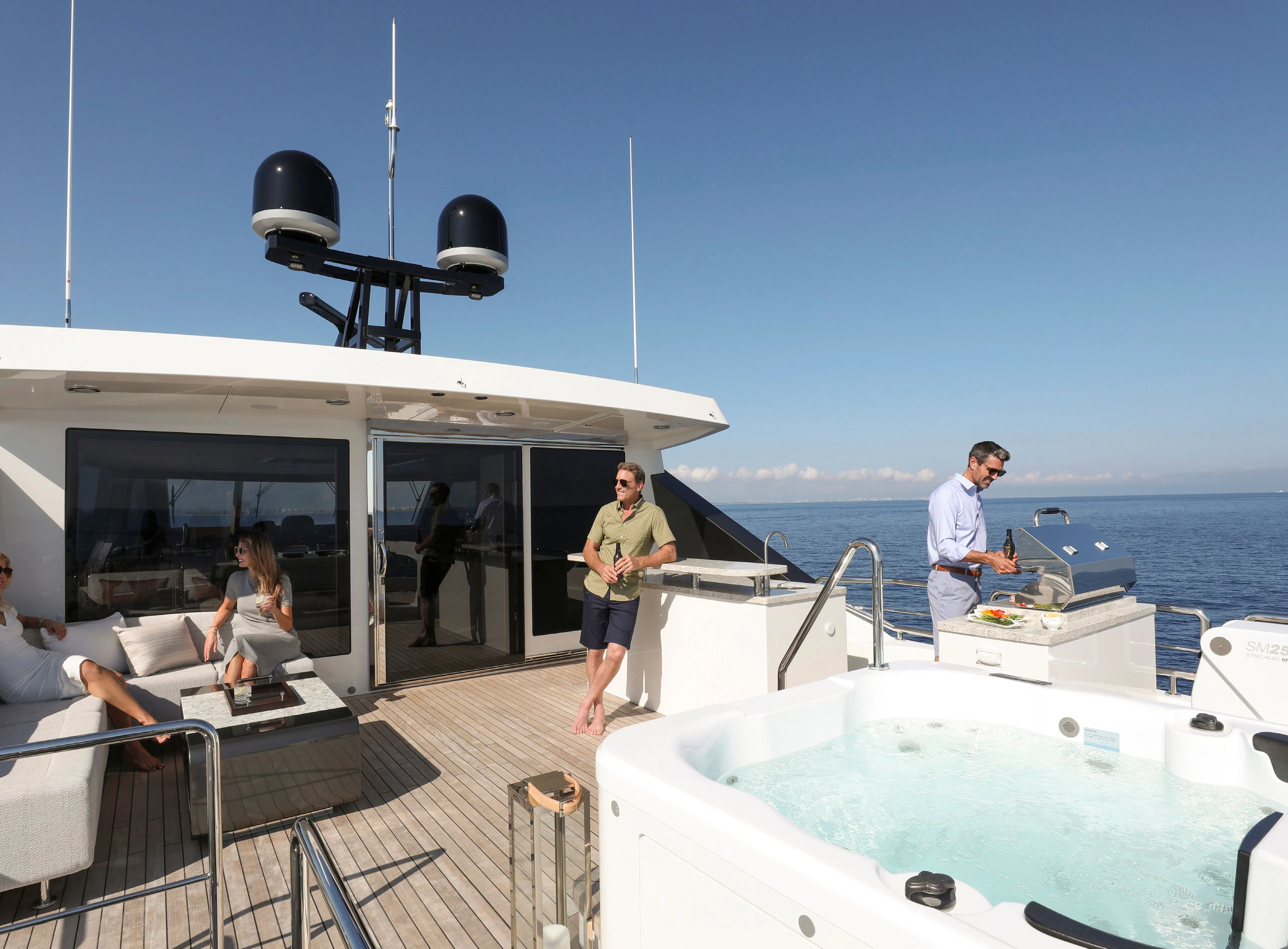 a group of people on a boat aboard OCEAN ALEXANDER 32L10 Yacht for Sale