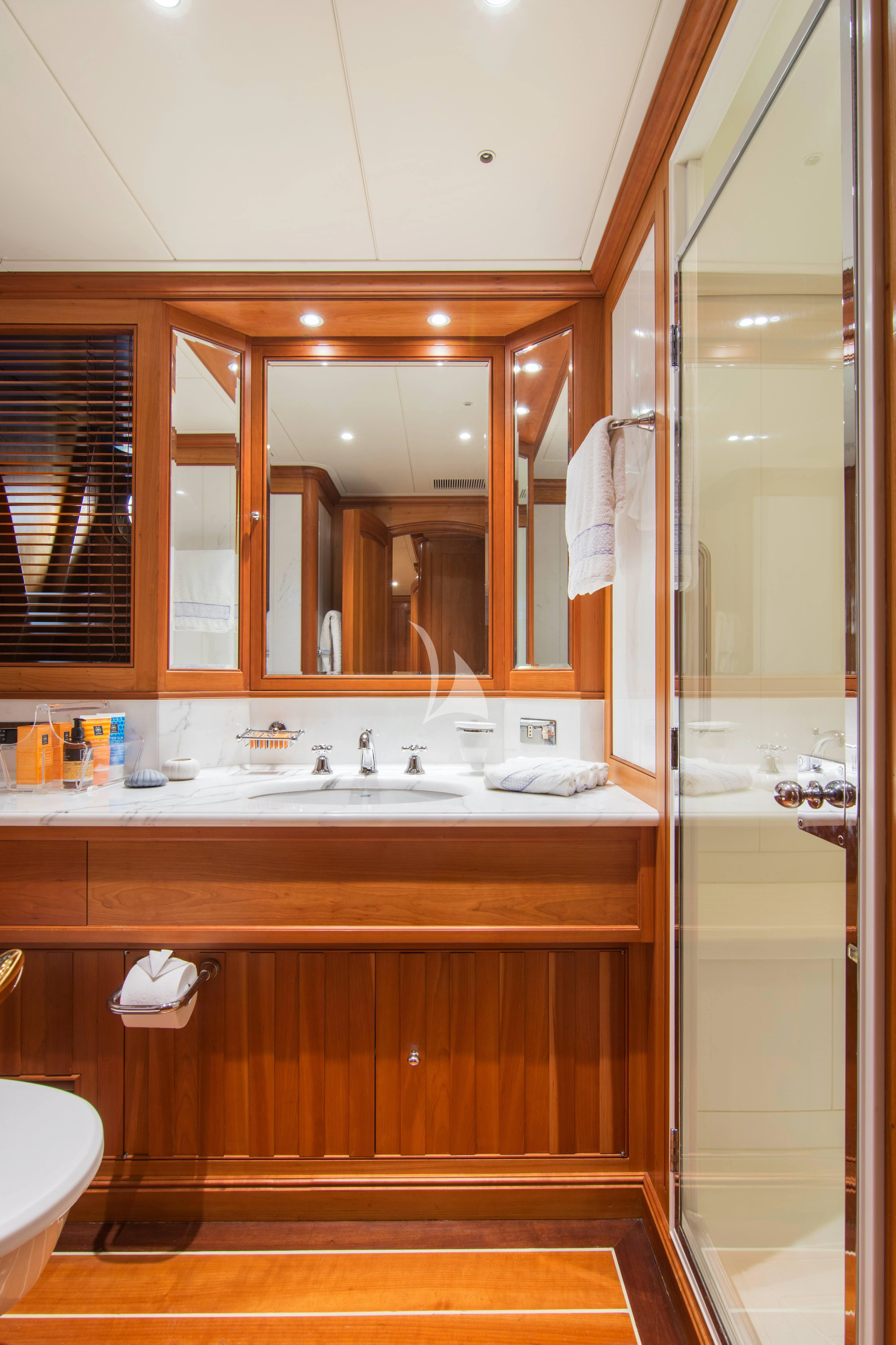 a bathroom with a large mirror aboard XASTERIA Yacht for Charter