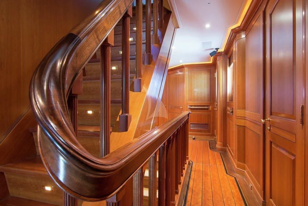a staircase in a building aboard XASTERIA Yacht for Charter