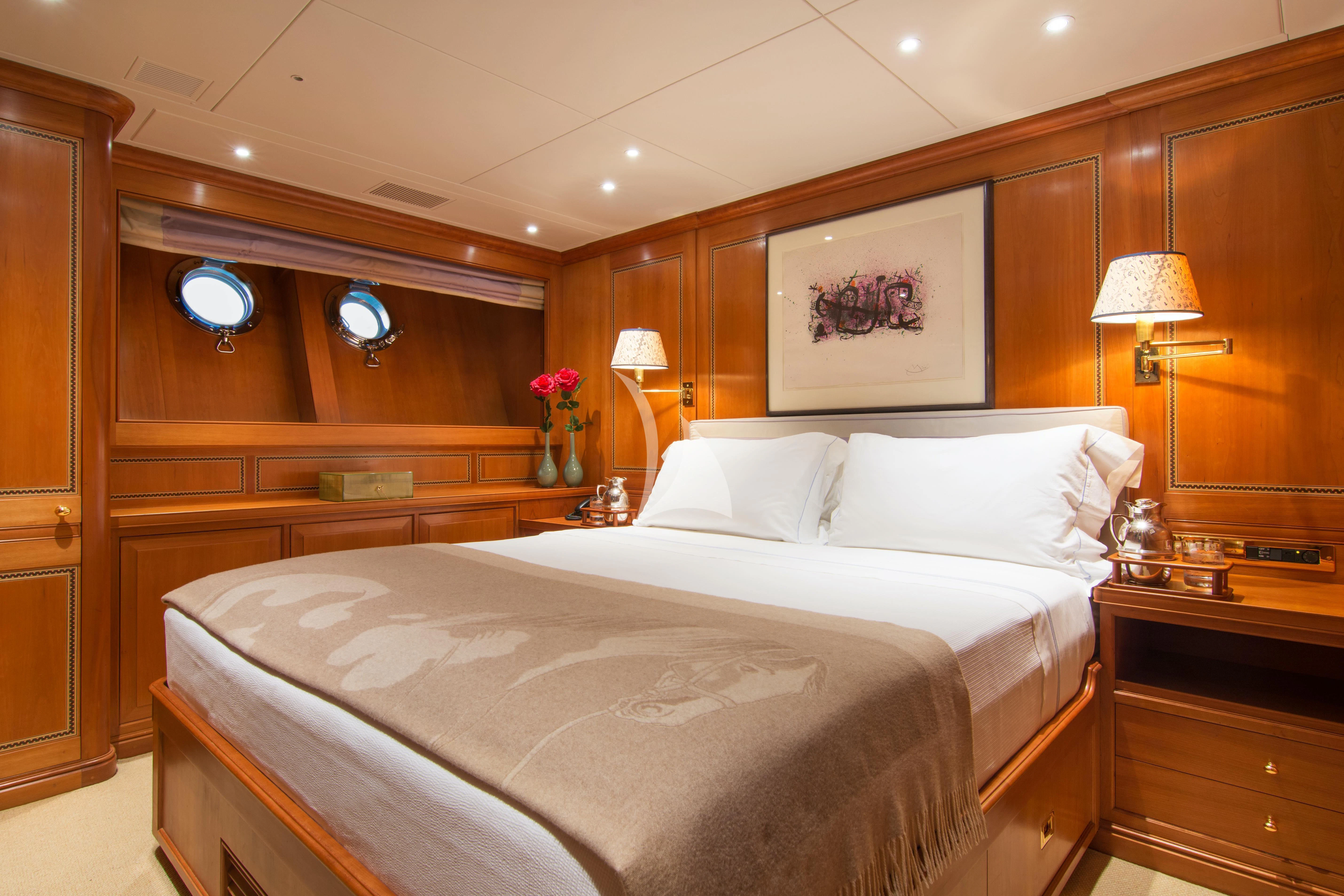 a large bed in a room aboard XASTERIA Yacht for Charter