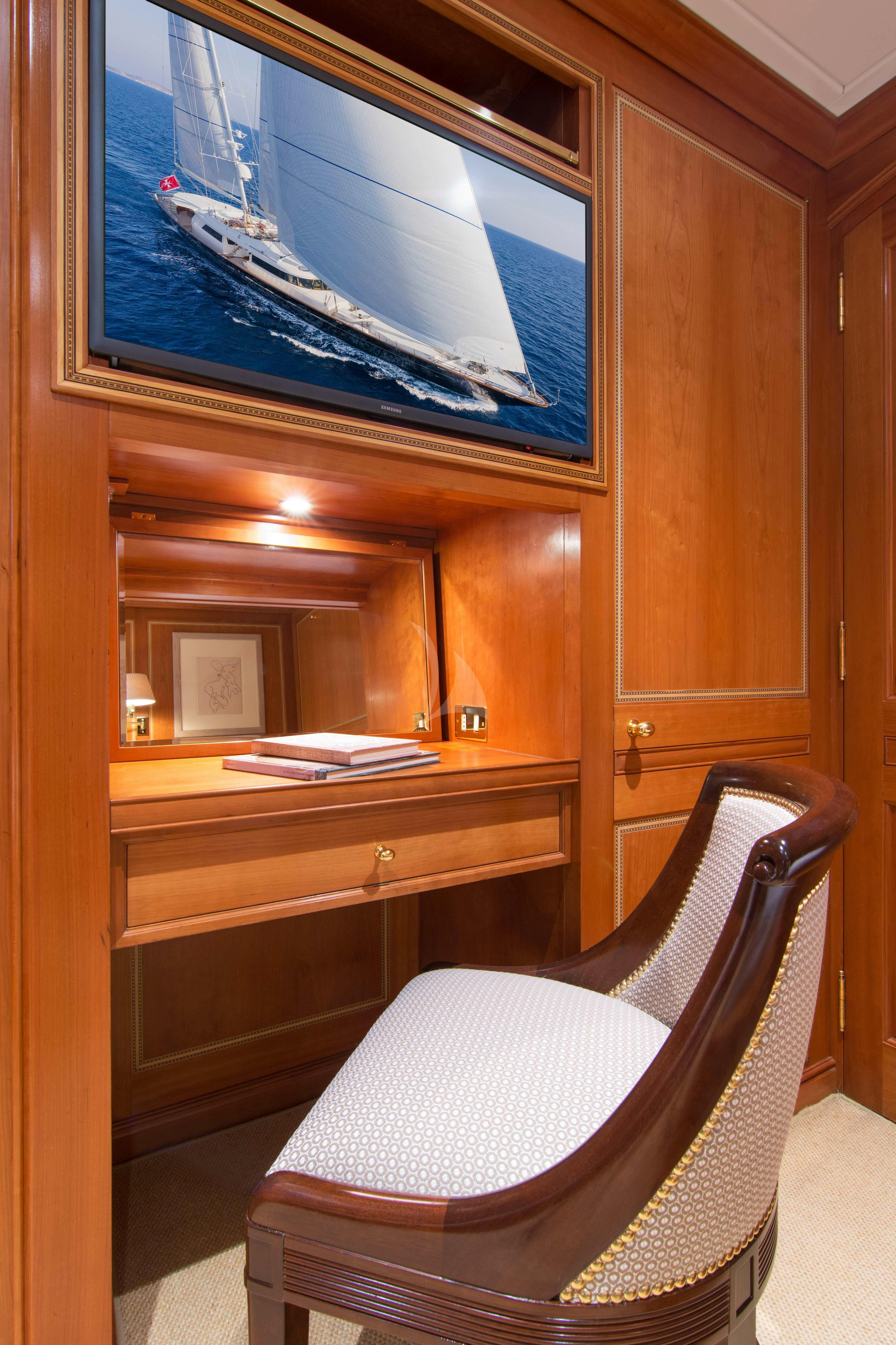 a chair in front of a window aboard XASTERIA Yacht for Charter