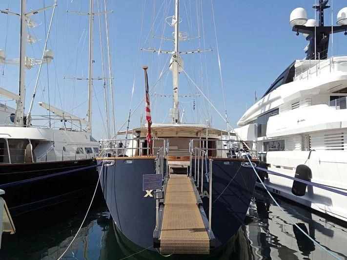a dock with boats aboard XASTERIA Yacht for Charter