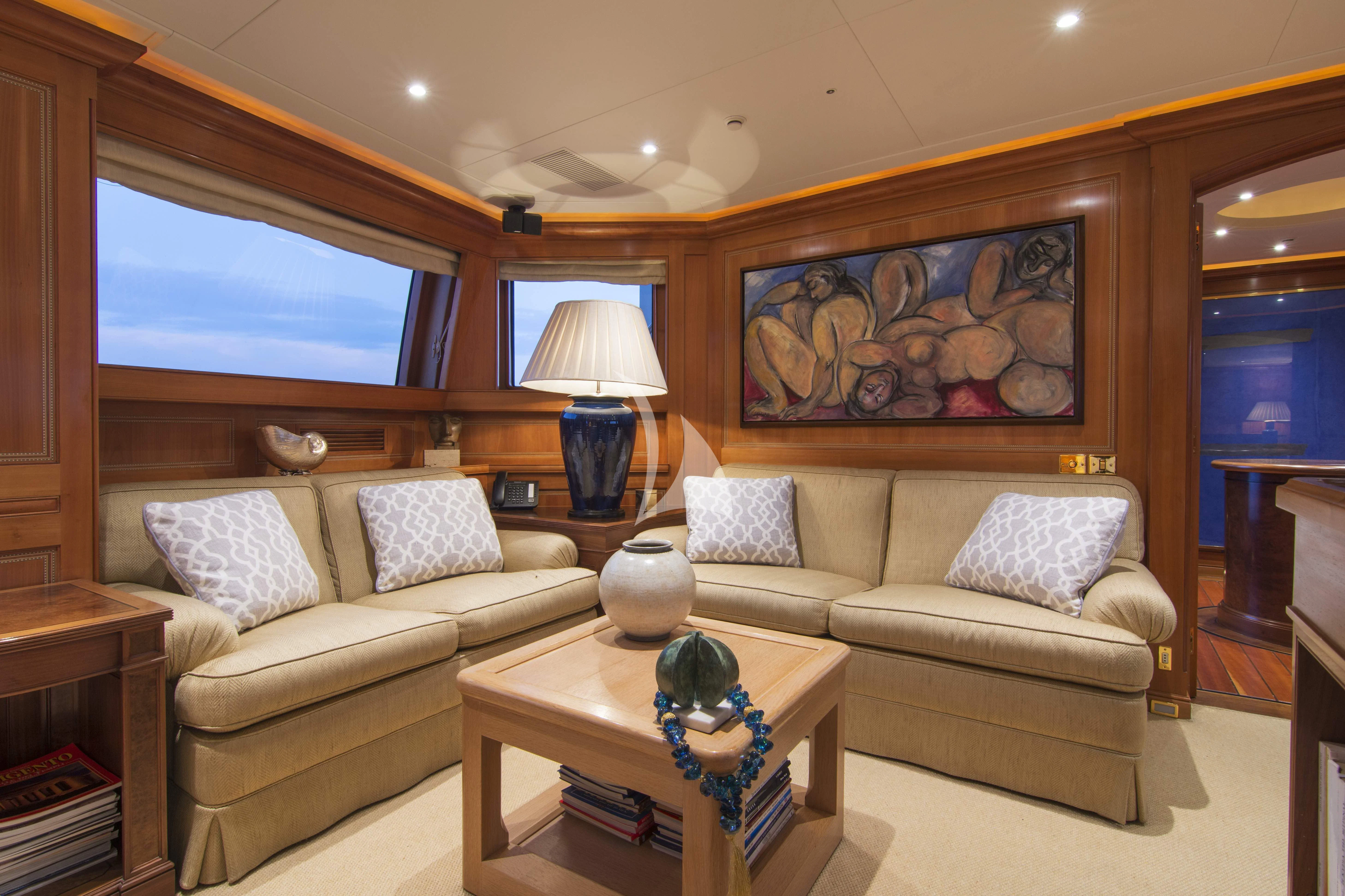 a living room with a couch and a coffee table aboard XASTERIA Yacht for Charter