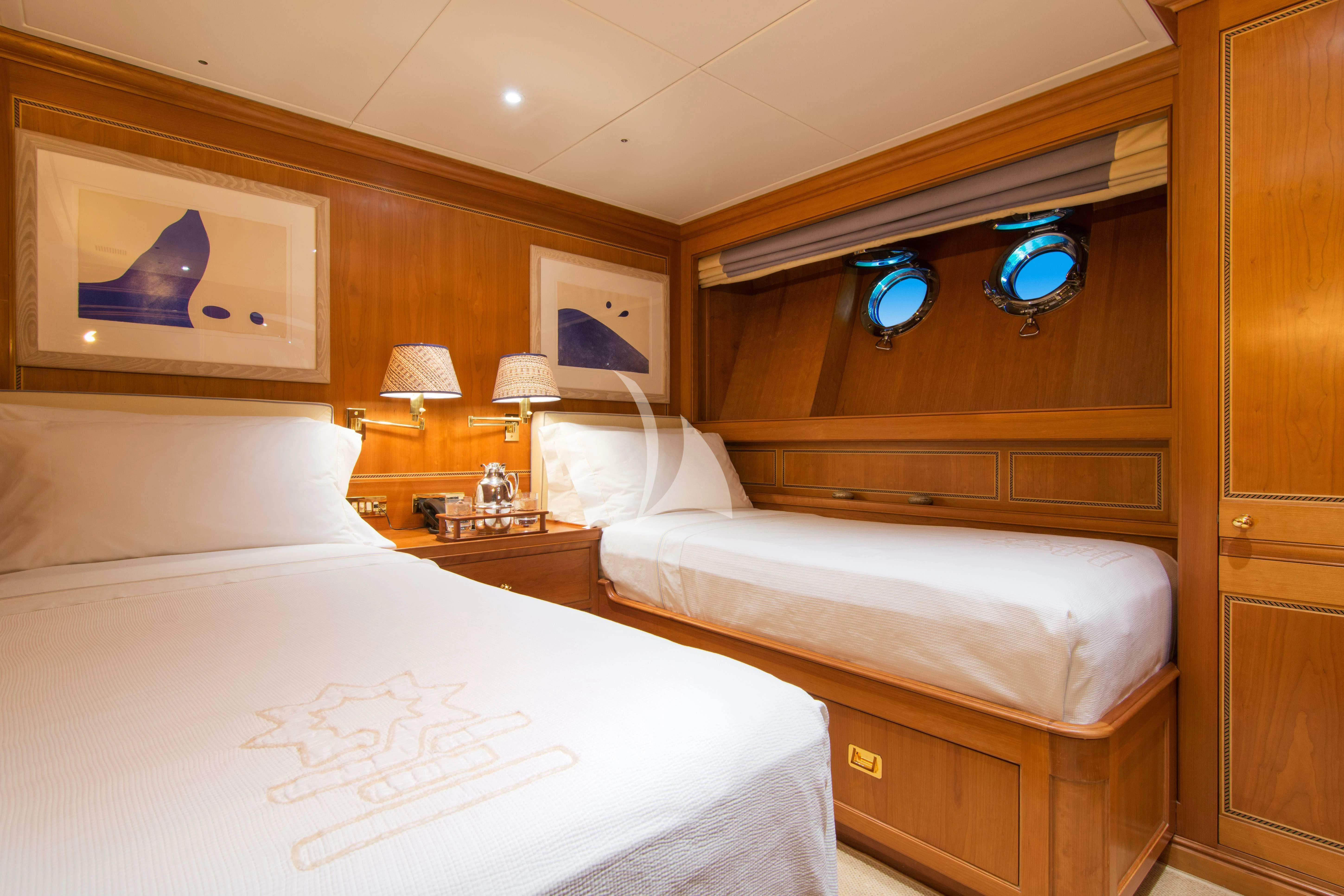 a room with two beds aboard XASTERIA Yacht for Charter